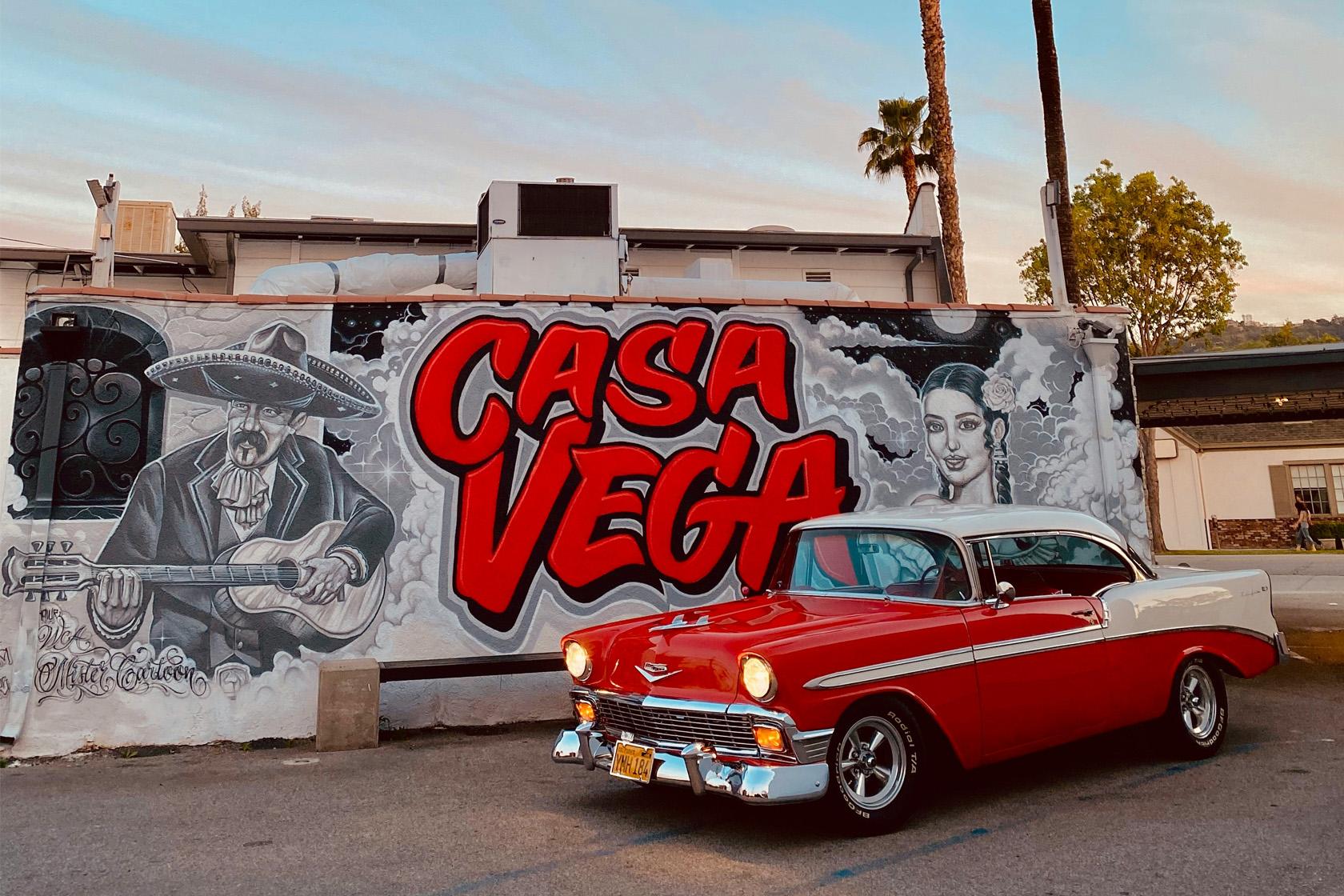 Woman throwing up LA with hands