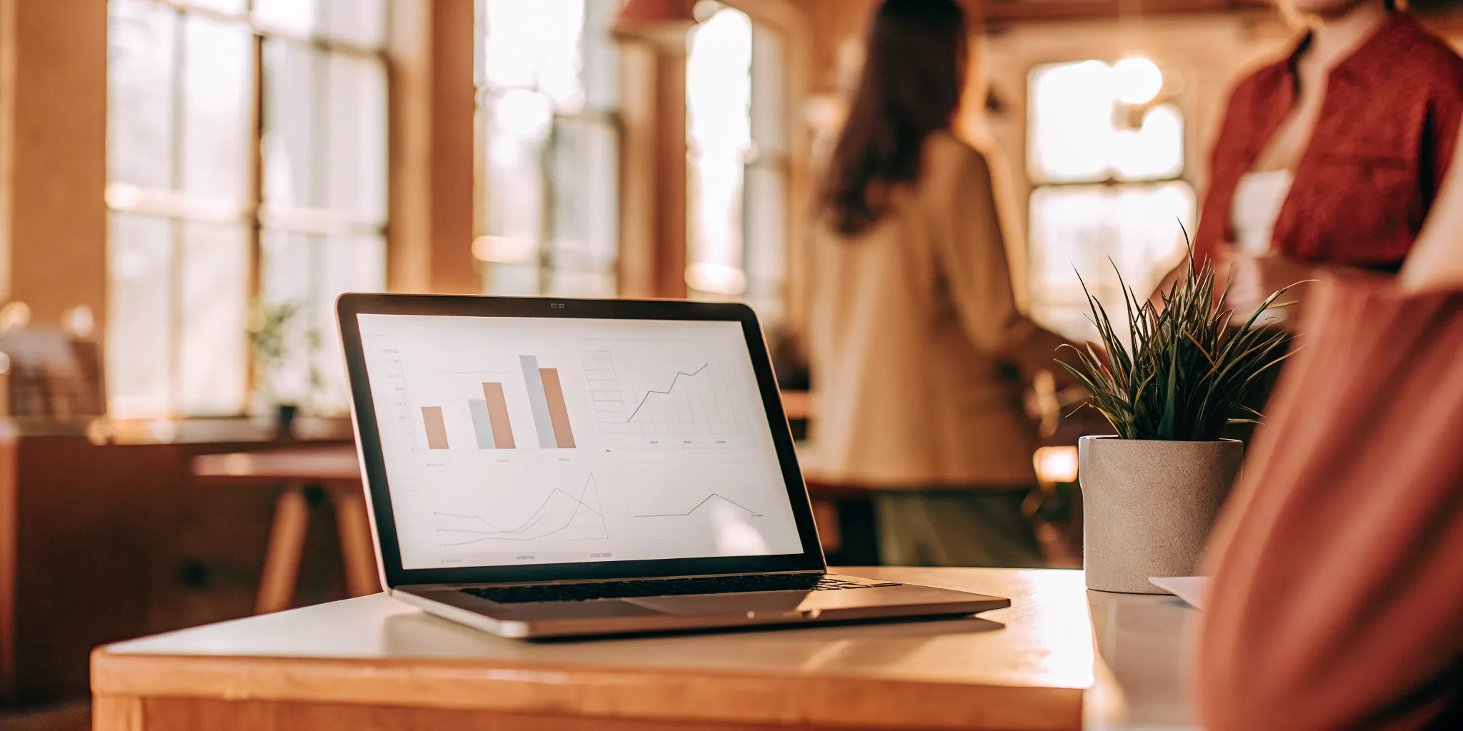 Laptop screen with charts comparing the key differences between a PEO and EOR.