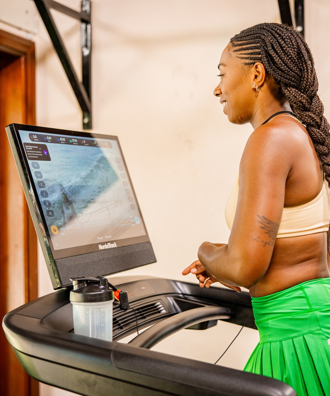 A woman working out on a NordicTrack treadmill.