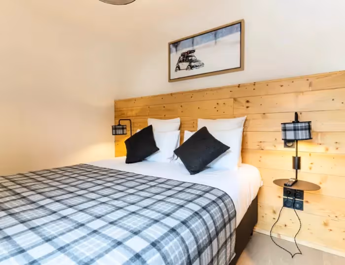 Chambre confortable dans un appartement de vacances à Combloux, Haute-Savoie, proche du Mont-Blanc et station de ski.