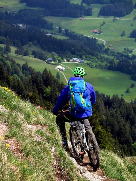 Mountain biking in summer in Combloux, sporting adventure in the French Alps facing Mont-Blanc.