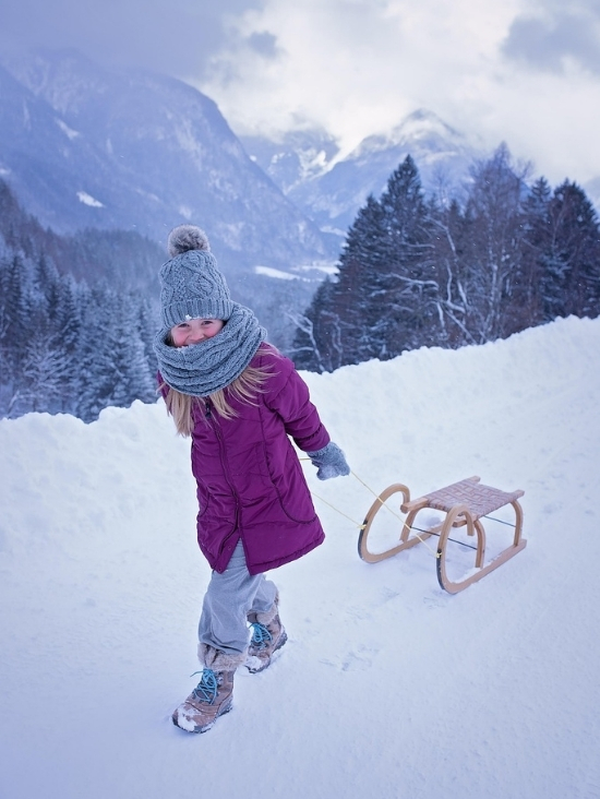 Sledding in winter in Combloux, family activity in the French Alps at Mont-Blanc.