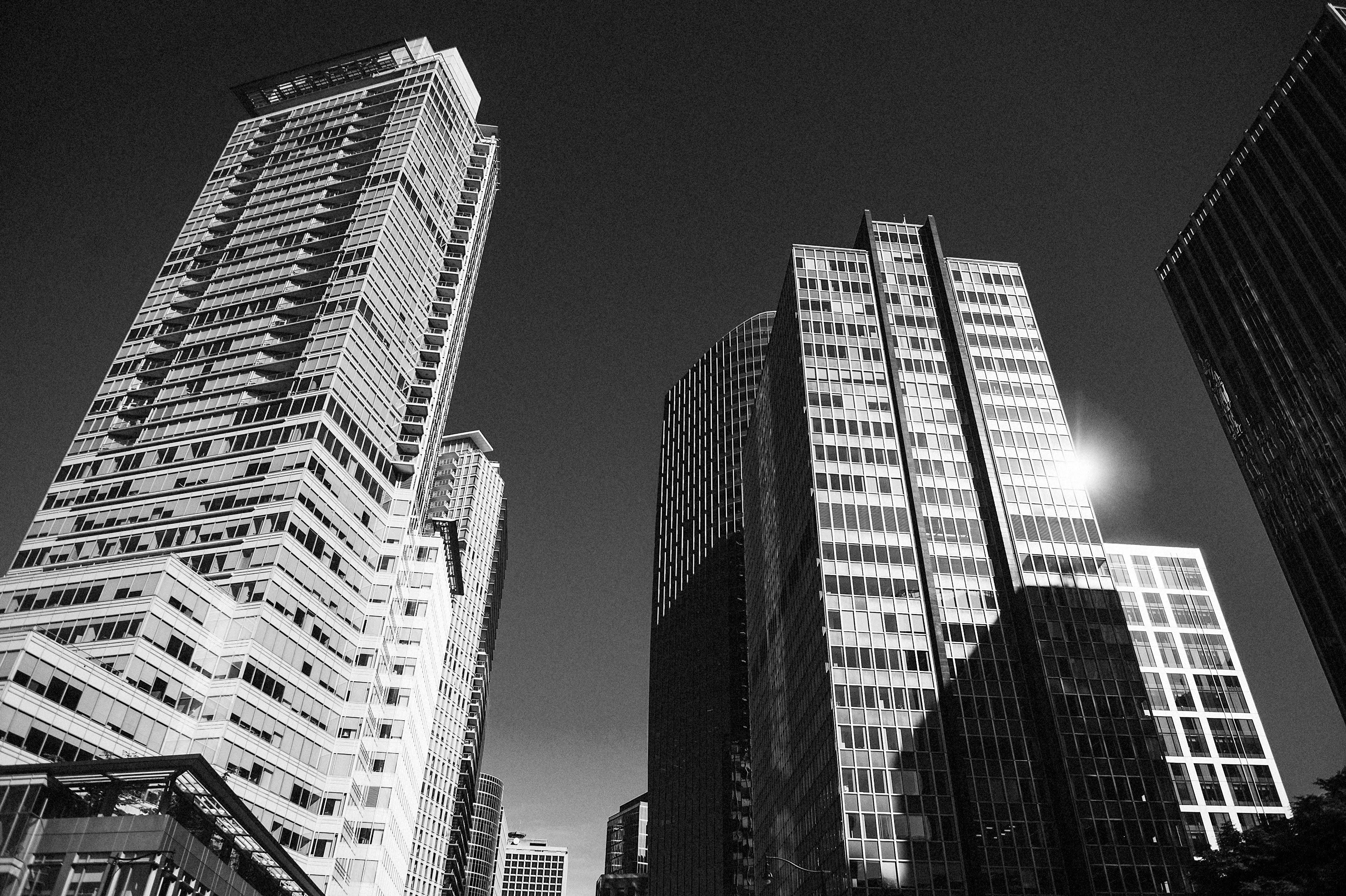 Angled photo of buildings in downtown vancouver reflecting the sun