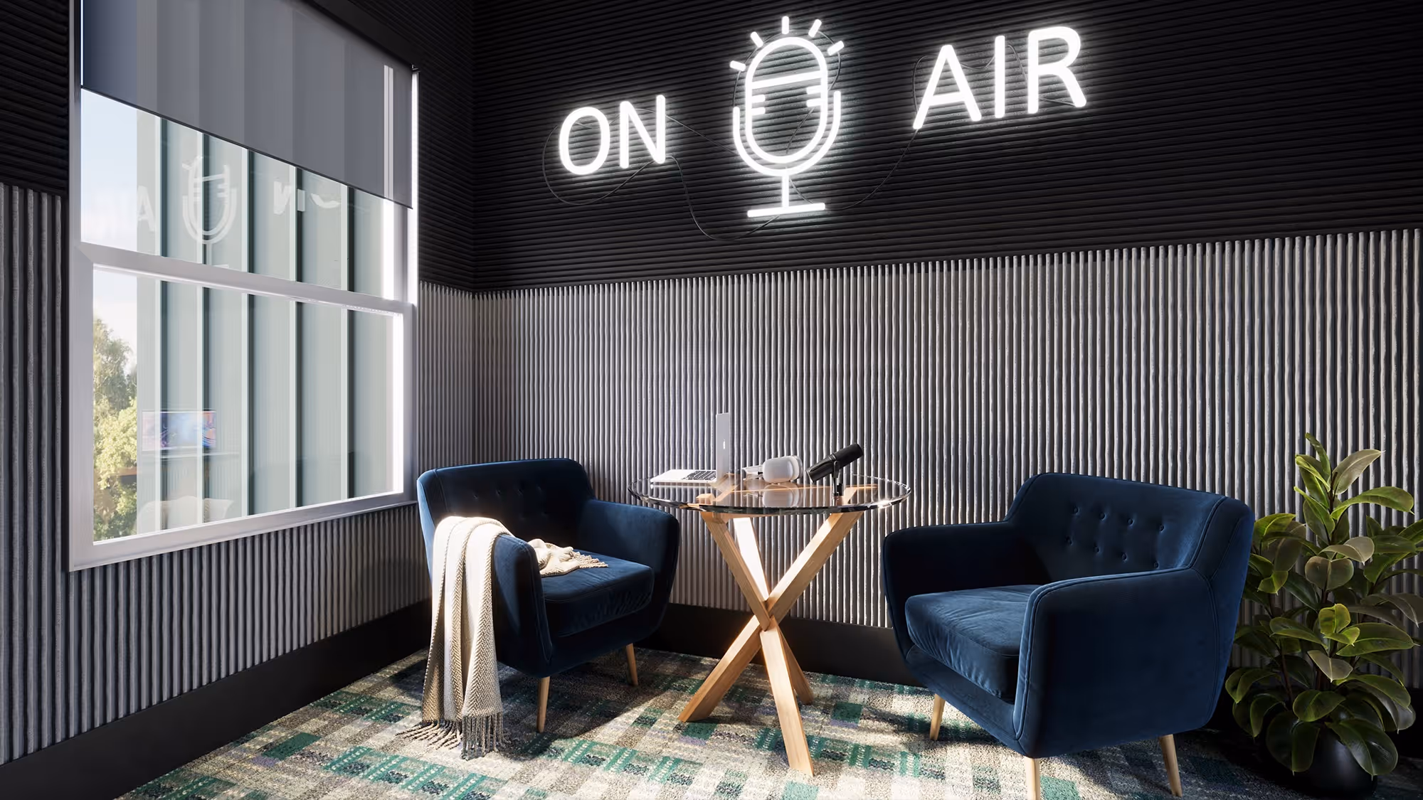 Community podcast and media studio at The Rook in Orlando, FL, featuring sound-dampened walls, velvet armchairs, and neon 'On Air' signage.