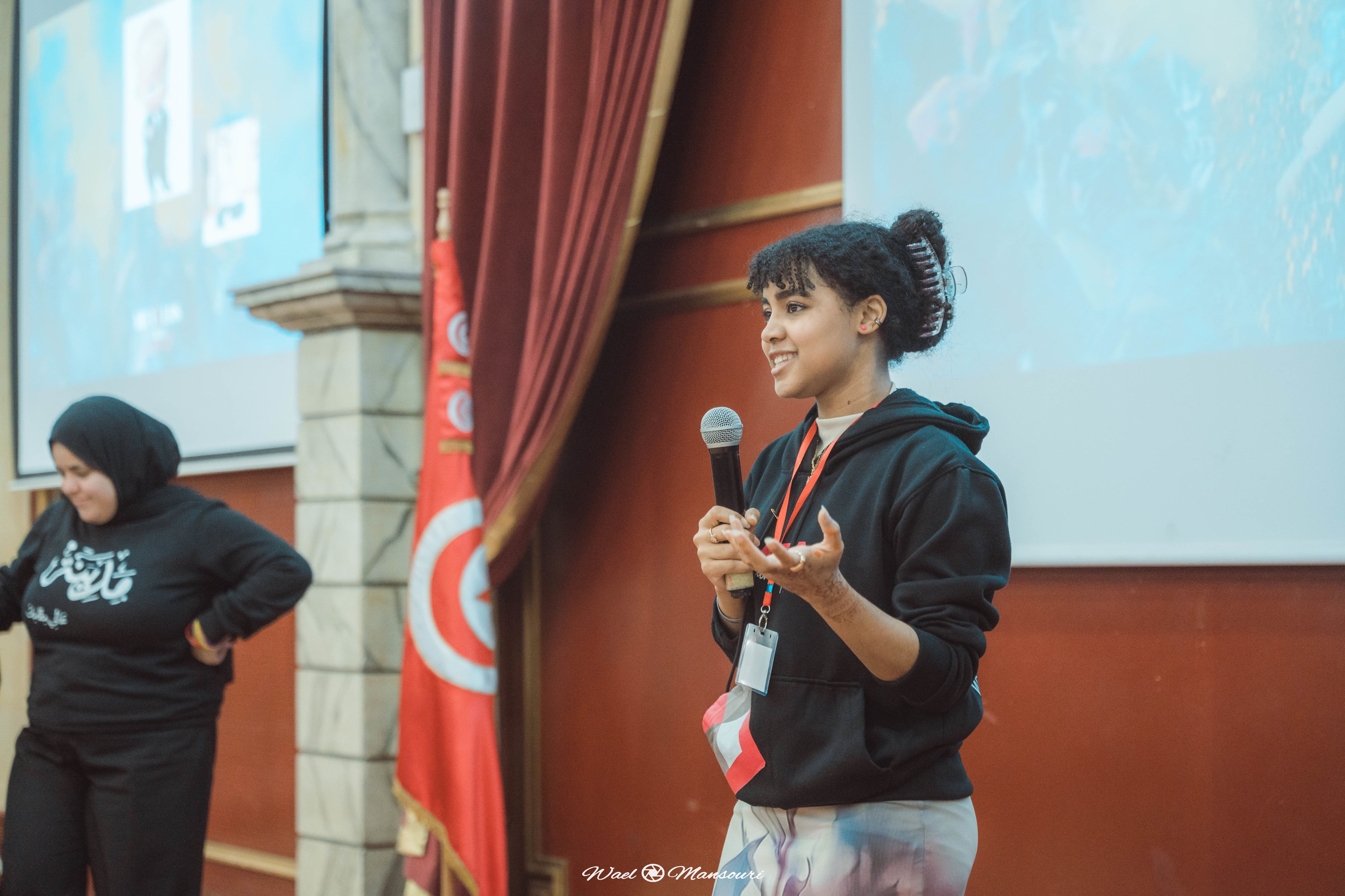 A young female person giving speech