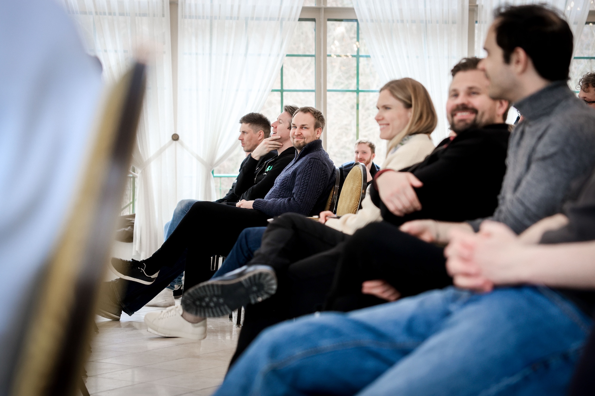 Founders listening and laughing