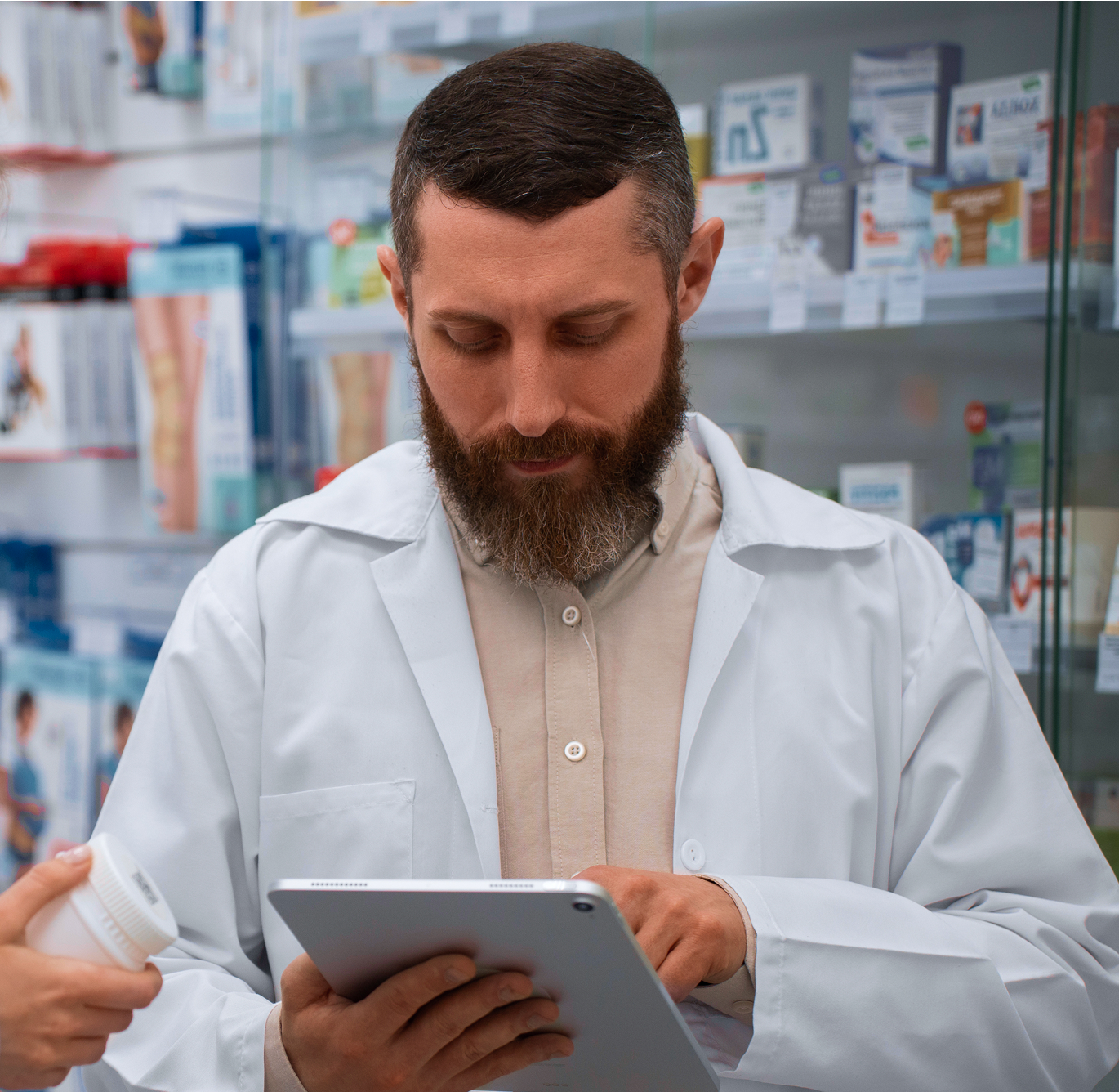 Two warehouse workers in safety gear reviewing a digital inspection checklist showing 100% score and 'Inspection passed' status.