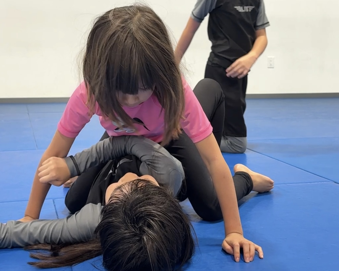 children practicing Jiu-Jitsu

