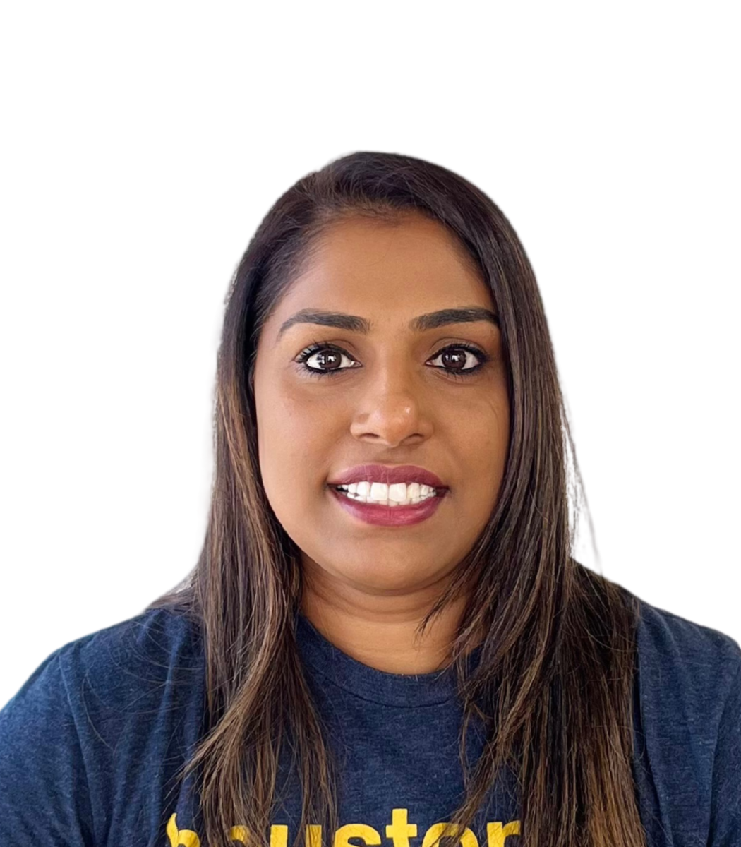 Smitha, owner and operations manager at Renzo Gracie Riverstone, smiling in a navy t-shirt, expert in academy management and student engagement.