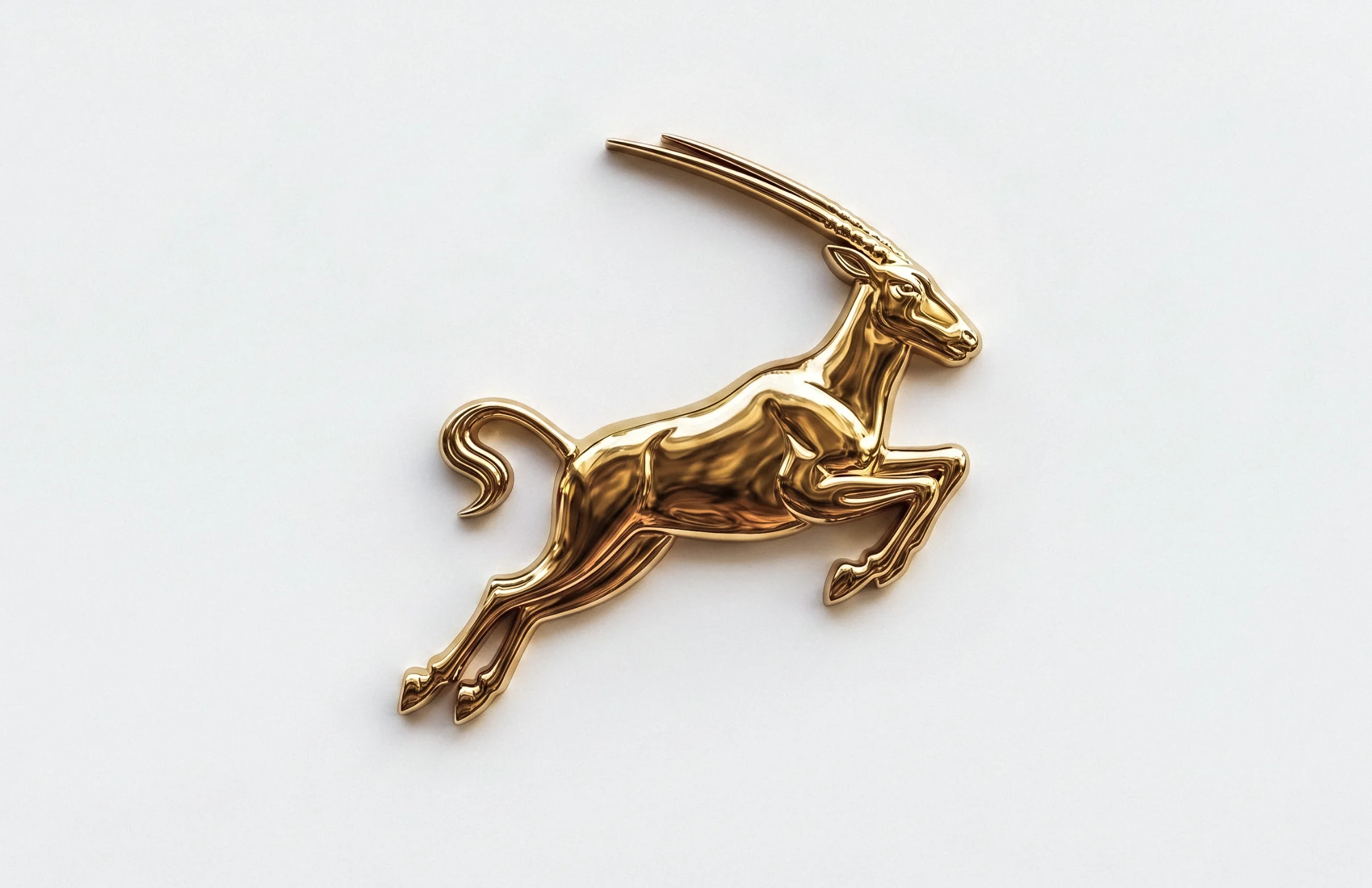 Cast gold rally emblem of the Oman Classics oryx.