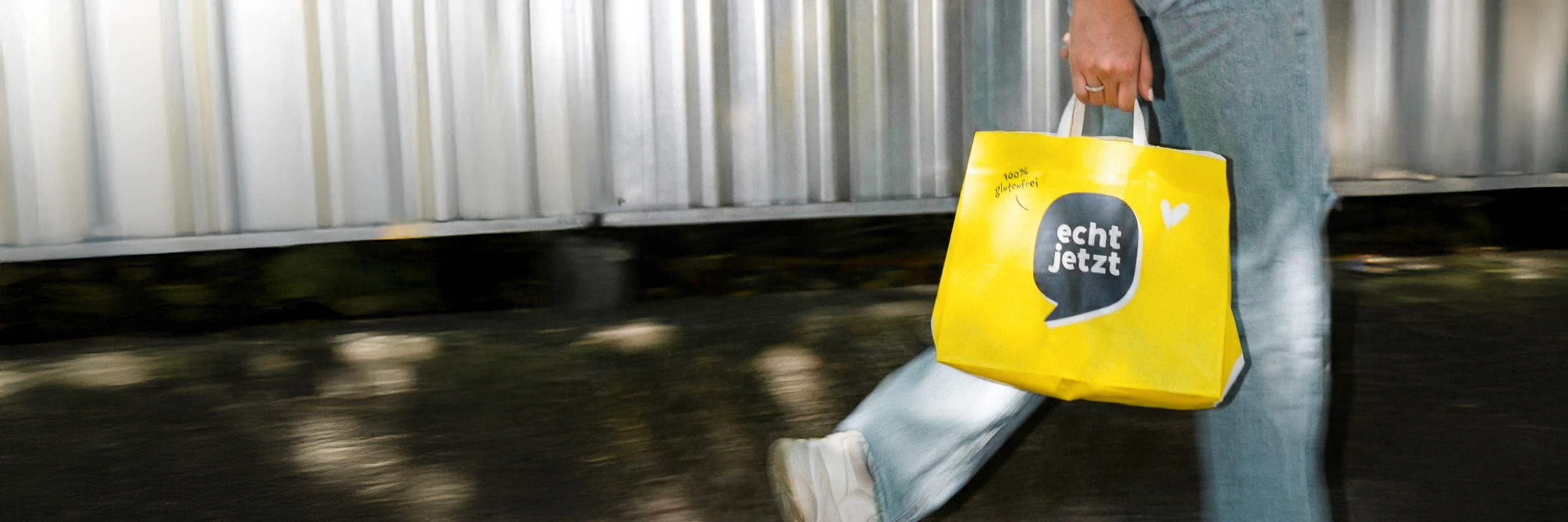 Custom printed paper carrier bag for echt jetzt — designed by Studio ONOM.