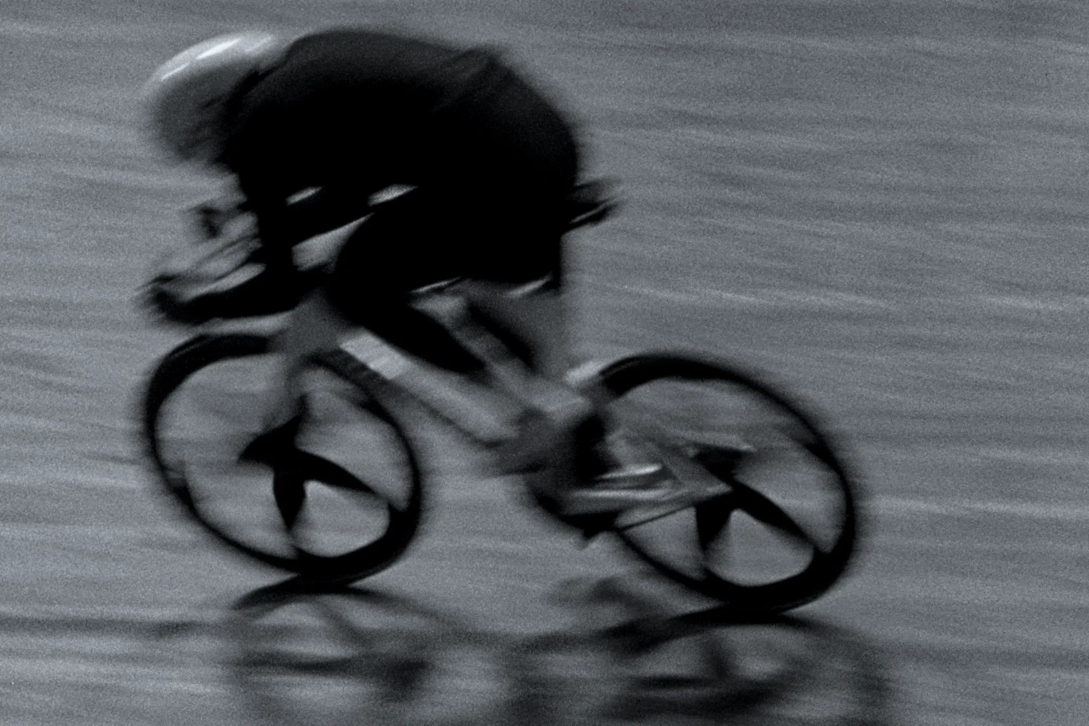 Track cyclist at speed, wheels blurred — LAPS by Dominik Leingartner, produced by Studio ONOM