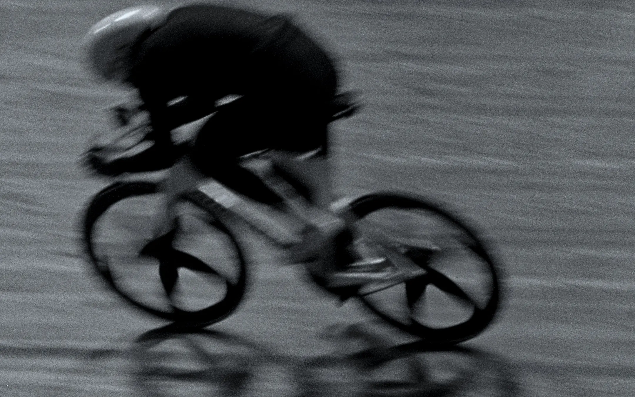 Track cyclist at speed, wheels blurred — LAPS by Dominik Leingartner, produced by Studio ONOM
