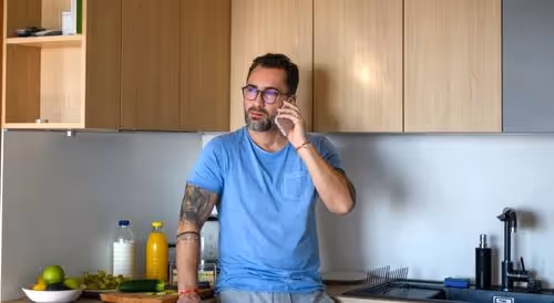 Man on the phone getting product info from AI agent
