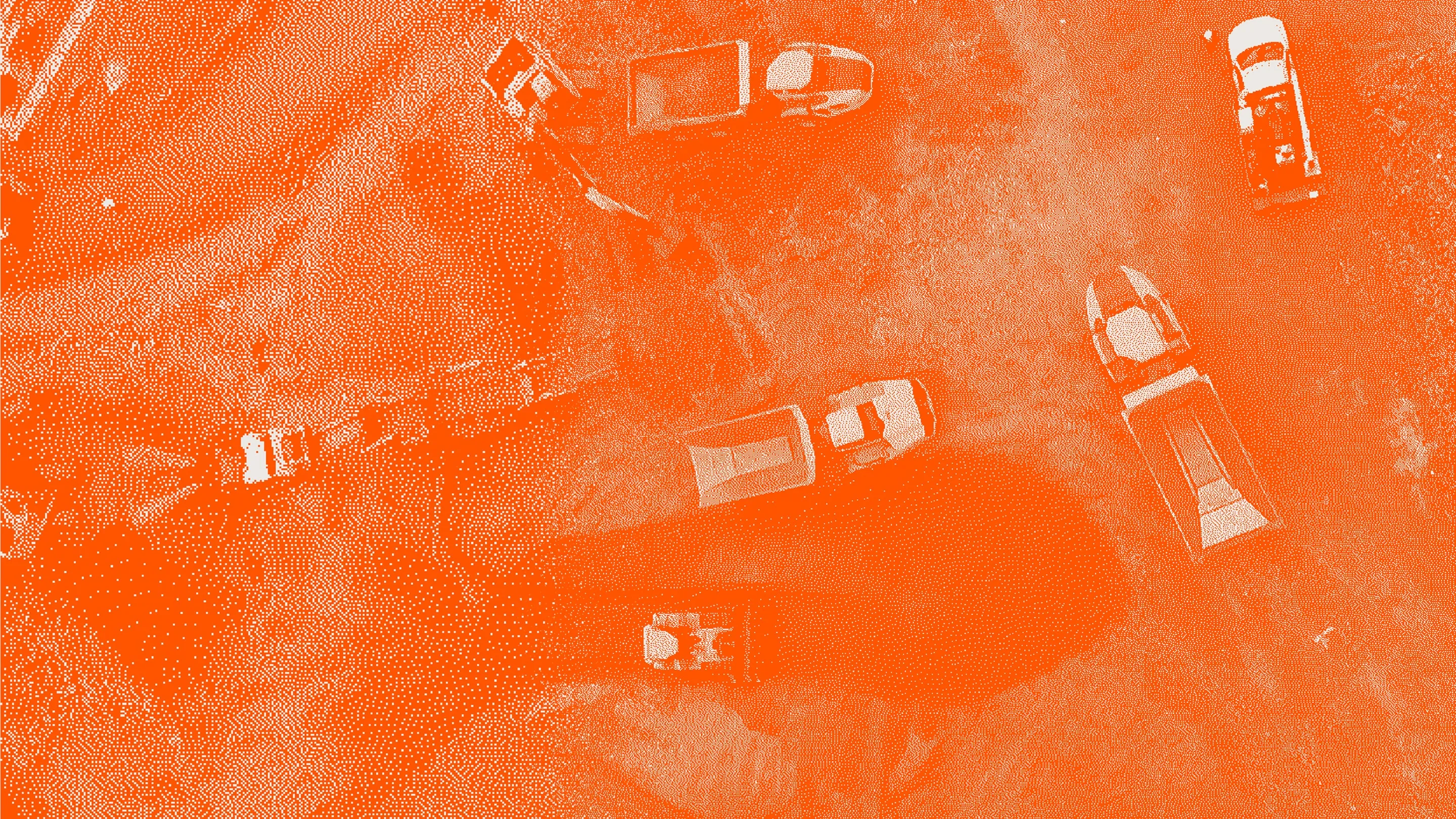 Aerial view of construction vehicles and equipment on a dirt site with an orange filter, showcasing RUX best business apps and industry solutions