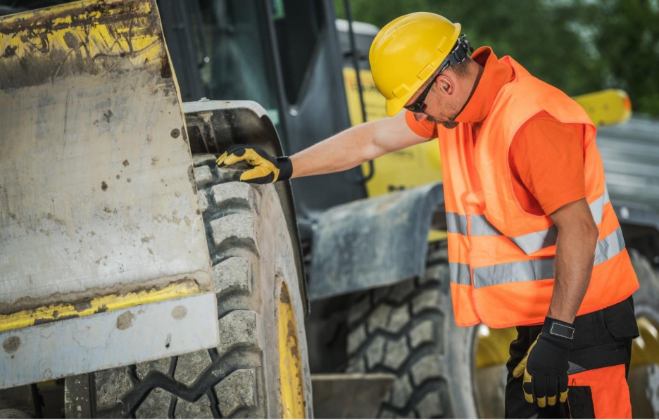 A person wearing a hard hat and safety vestAI-generated content may be incorrect.