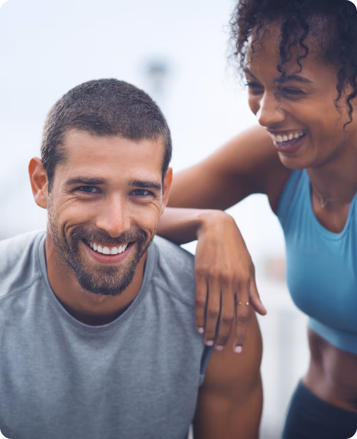 A man and a woman smiling for the camera.