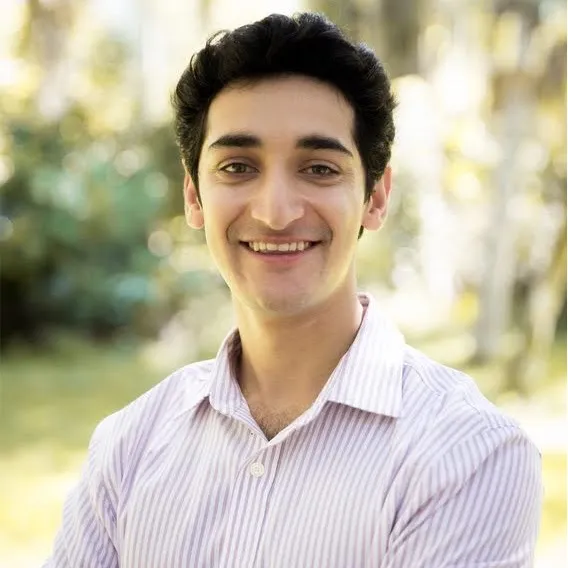 A photo of Ravi Khurana, a man with dark hair in a collared white shirt.