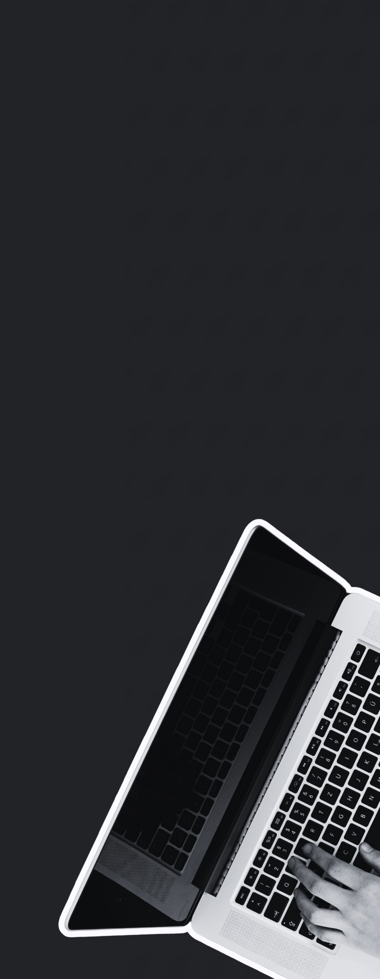Hands typing on a laptop.
