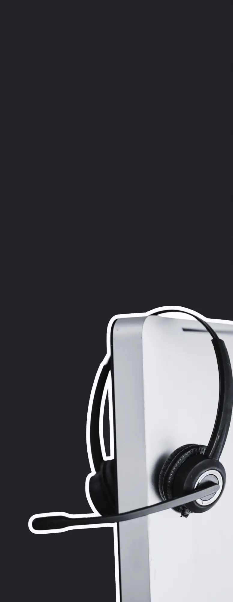 A desktop monitor with a headset.