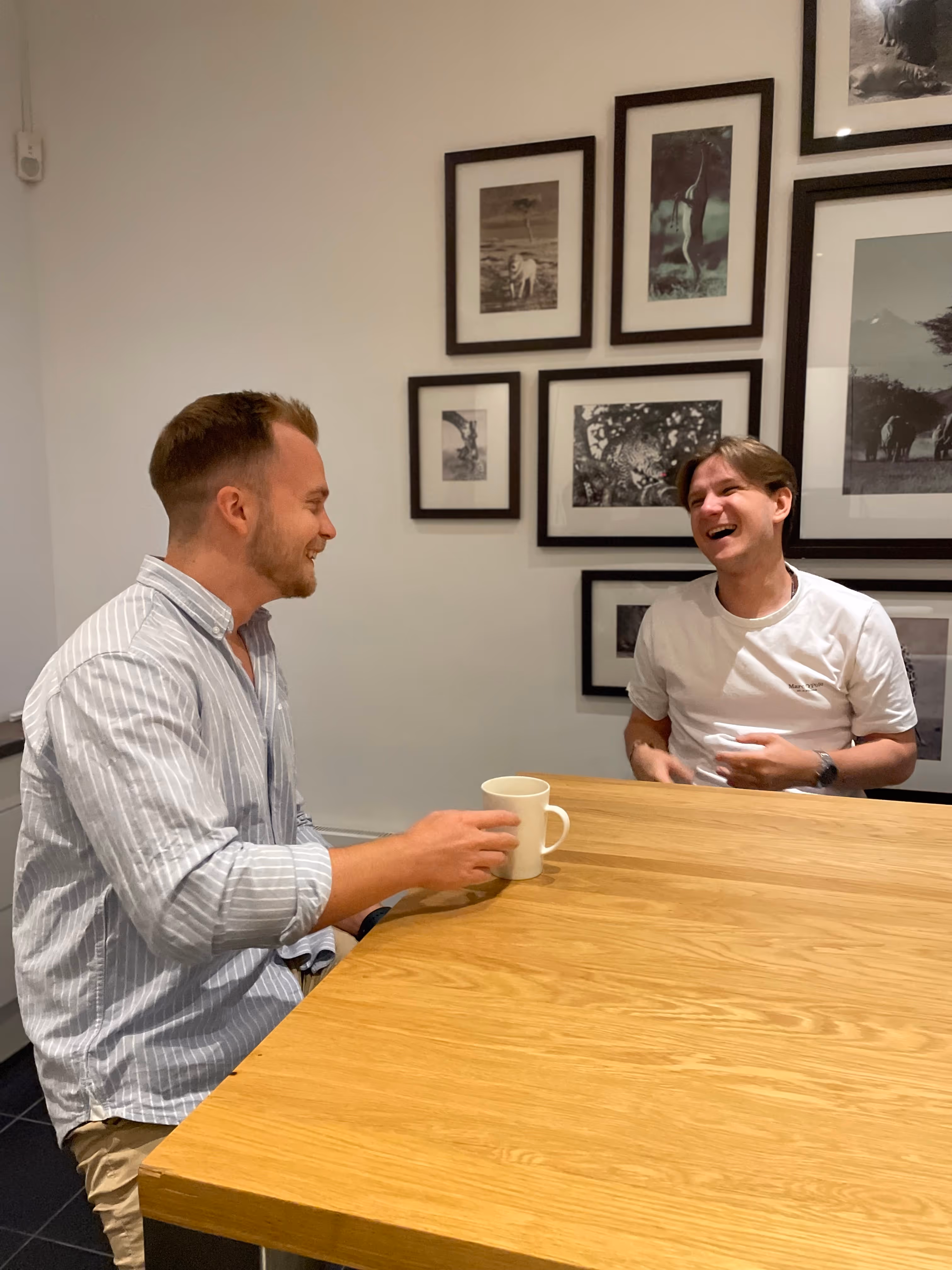 Nicolas and tom laughing in the office