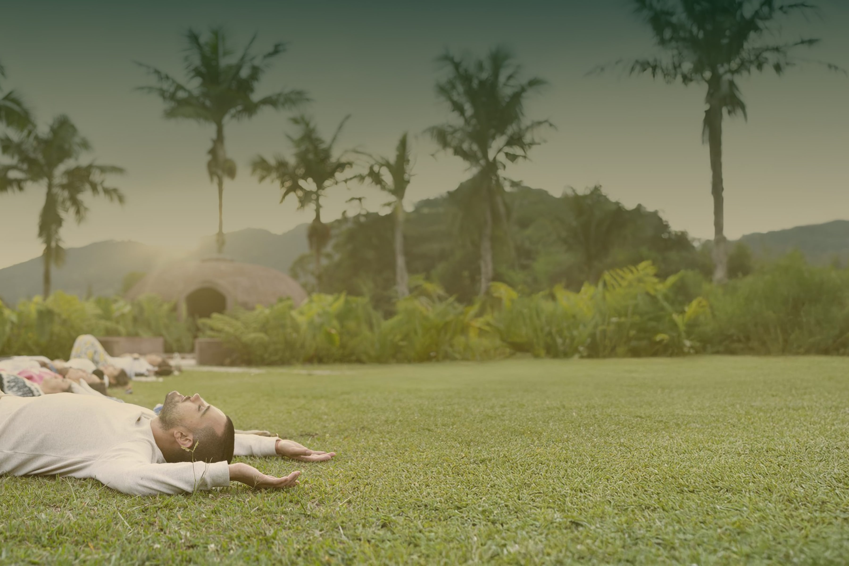 Group laying on grass outside