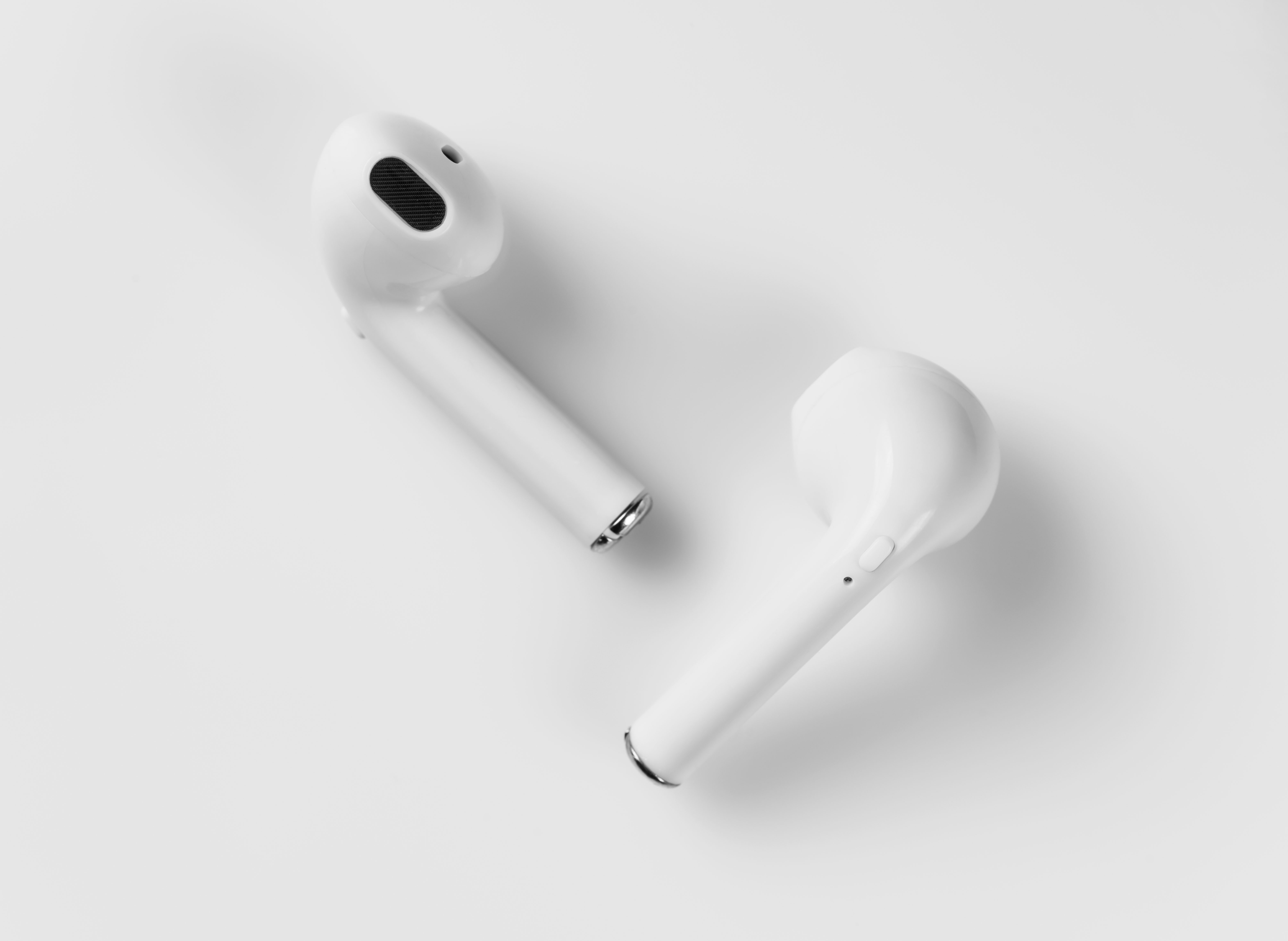 A pair of white ear buds.