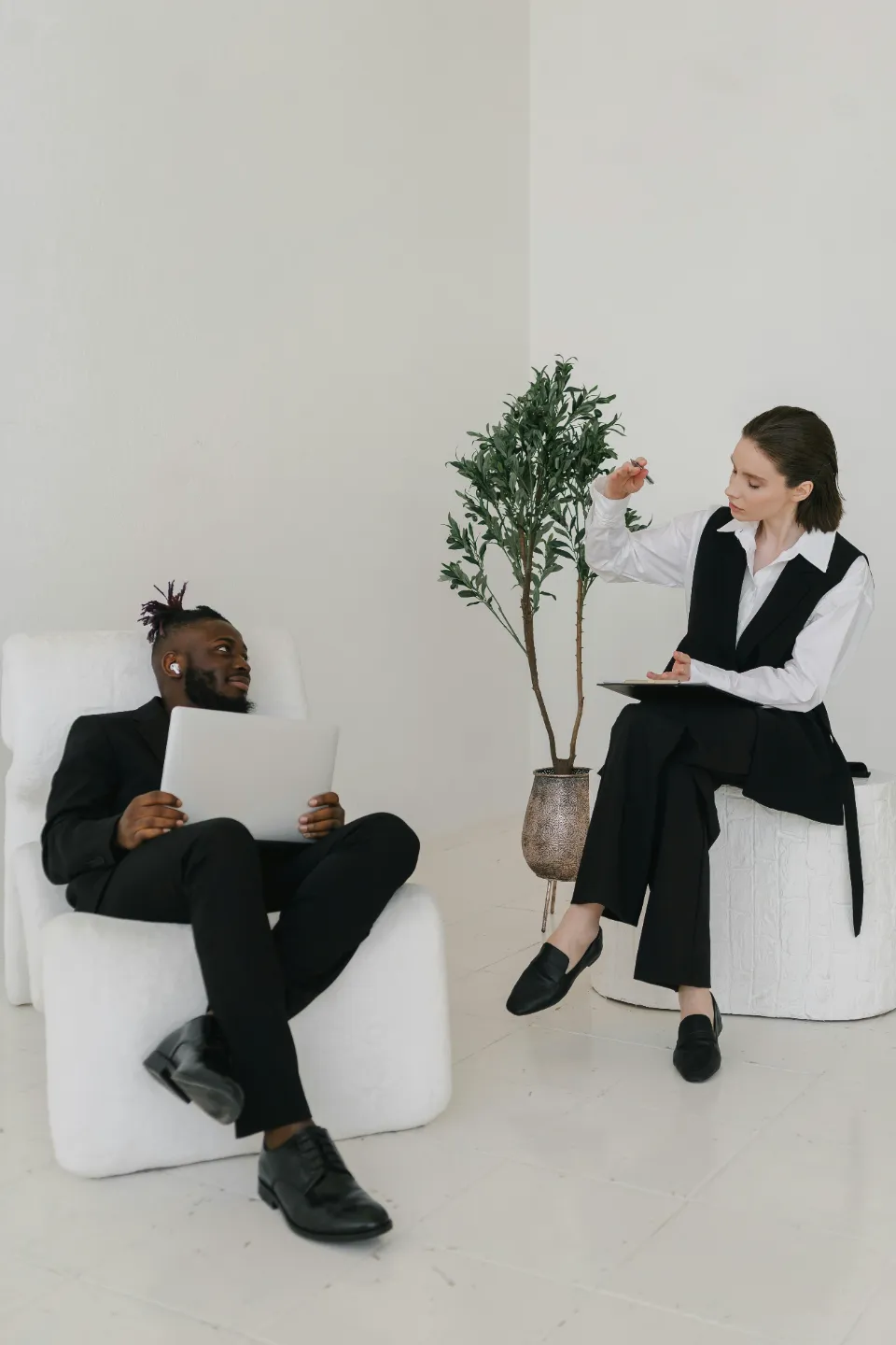 woman and man sitting on a chair