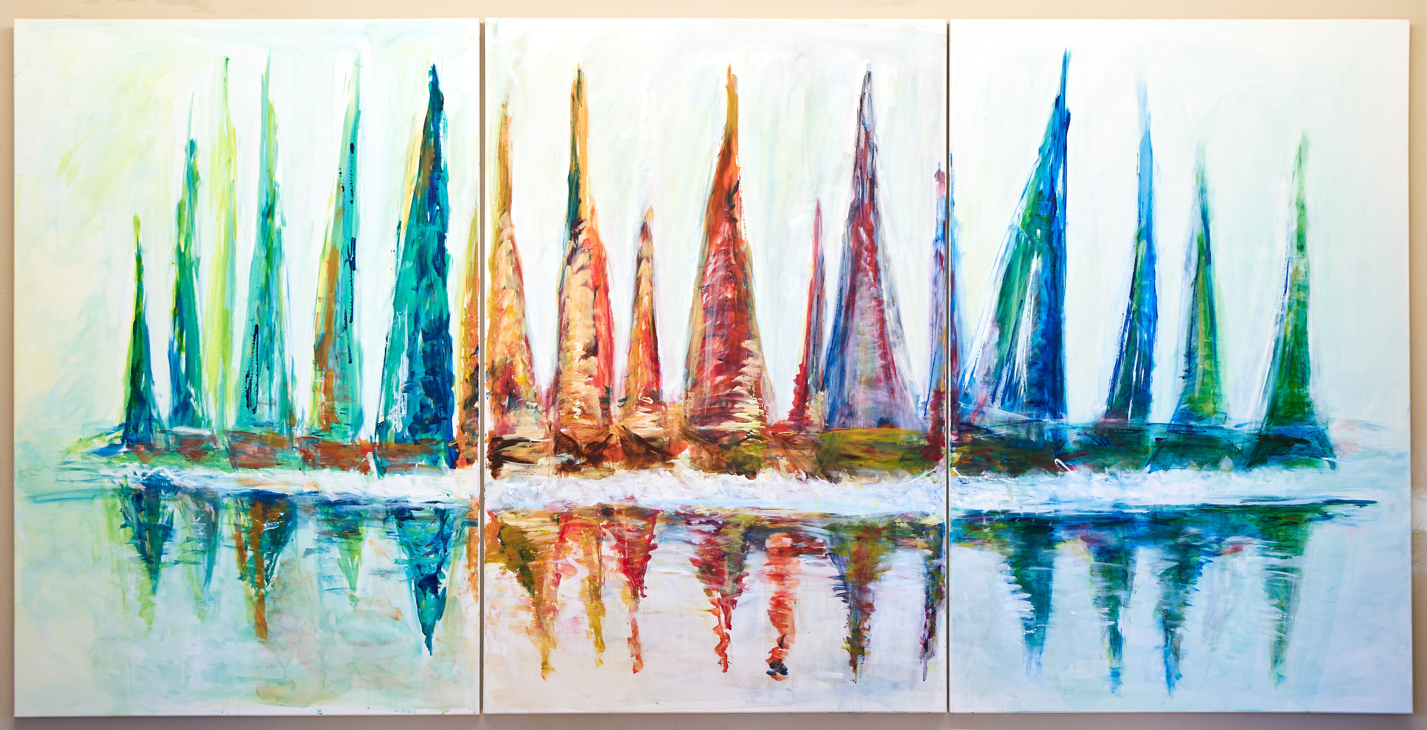 A triptych painting of colorful sailboats on water, created for Tenuta Golo Winery in Montepulciano, featuring vibrant hues of teal, orange, and red with reflections on a serene surface.