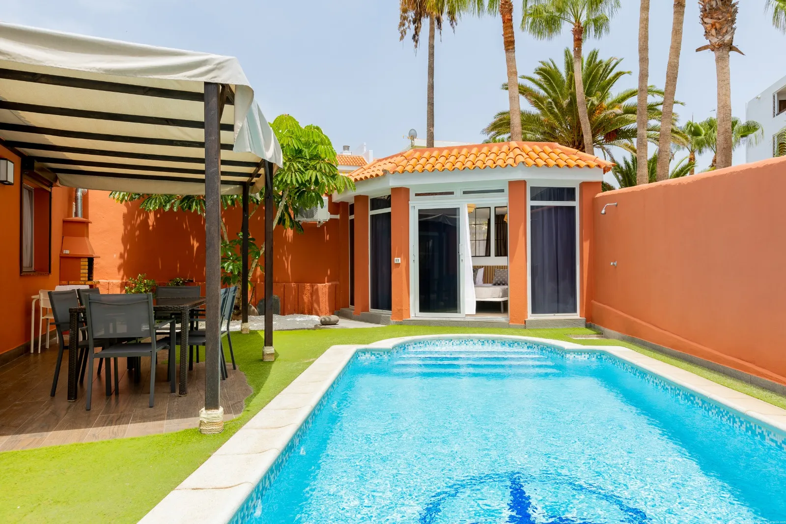 front of a house and private swimming pool