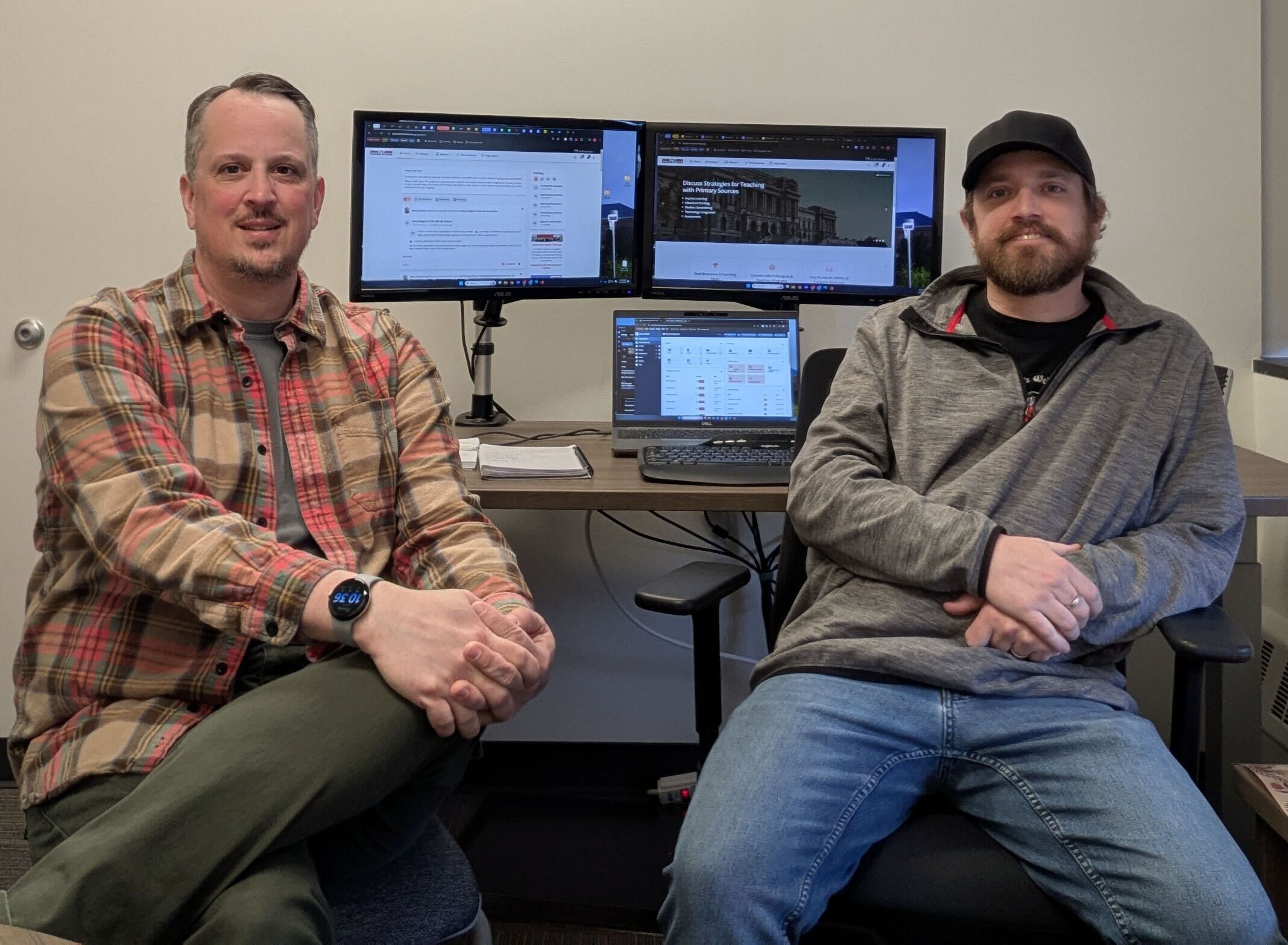 Metro State TPS team members sitting in front of dual monitors displaying the redesigned TPS Teachers Network platform.