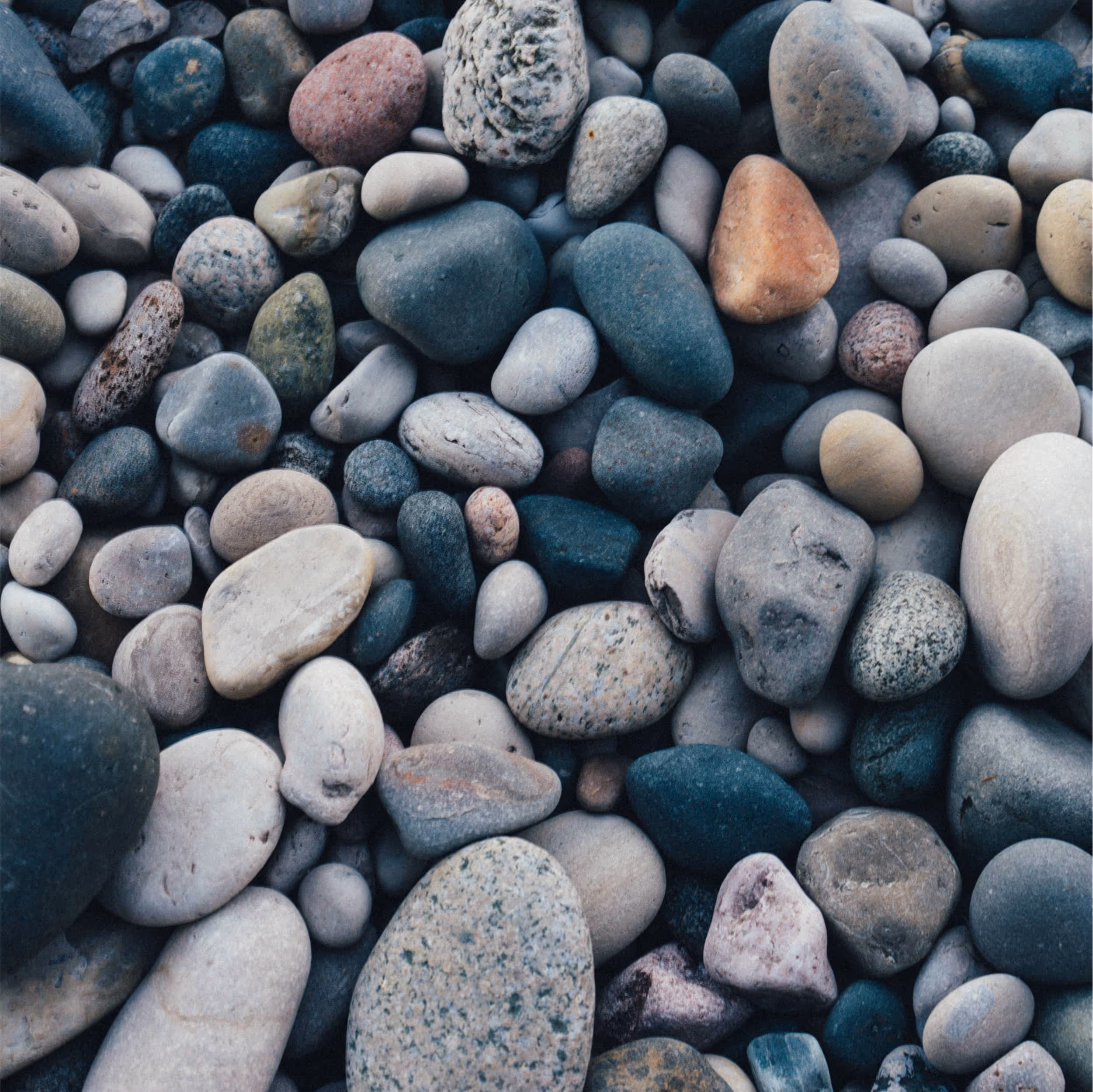 Close-up view of colorful, rounded river stones.