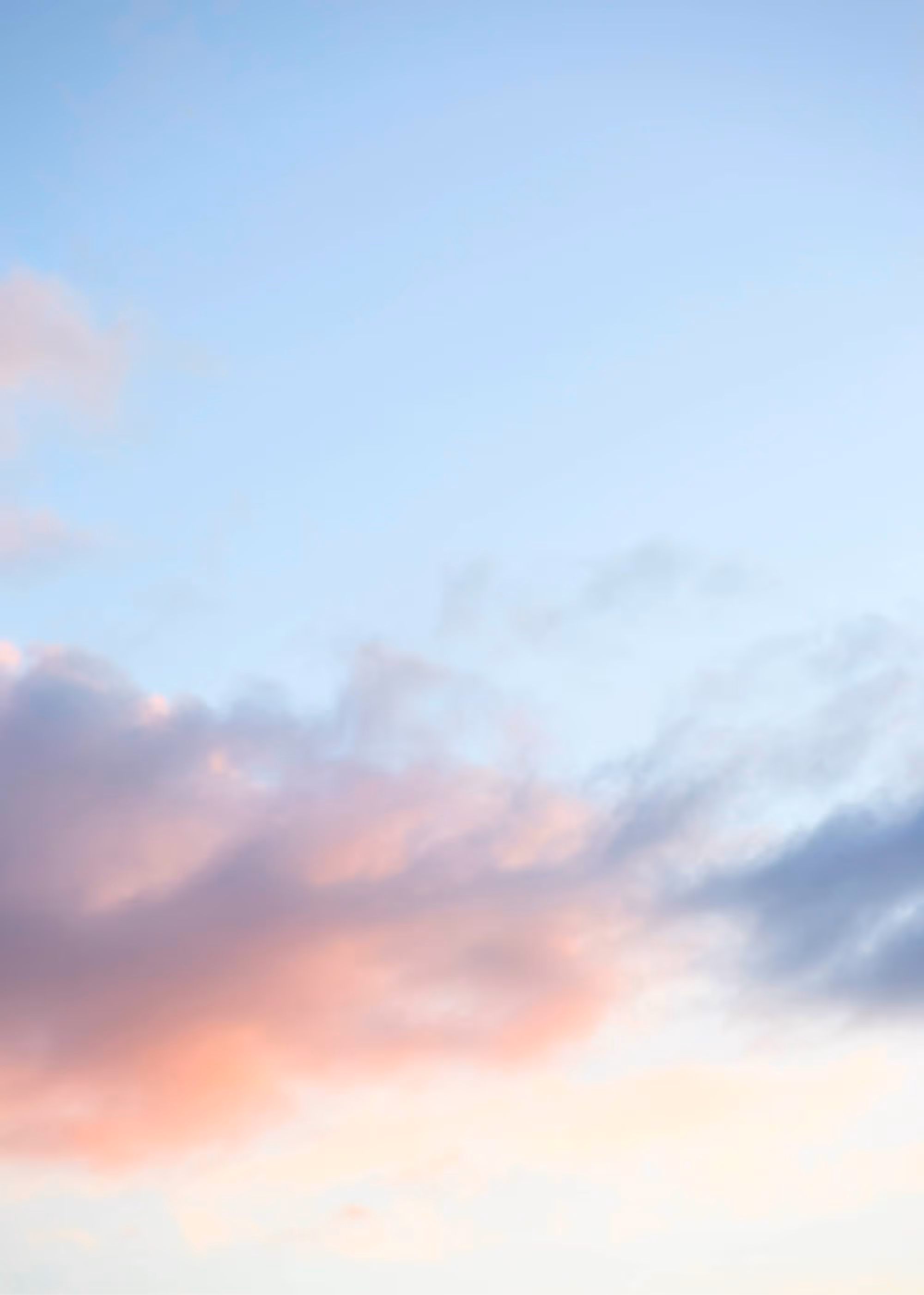 Soft clouds in a calm sky, representing the mental clarity achieved when work conditions are changed.