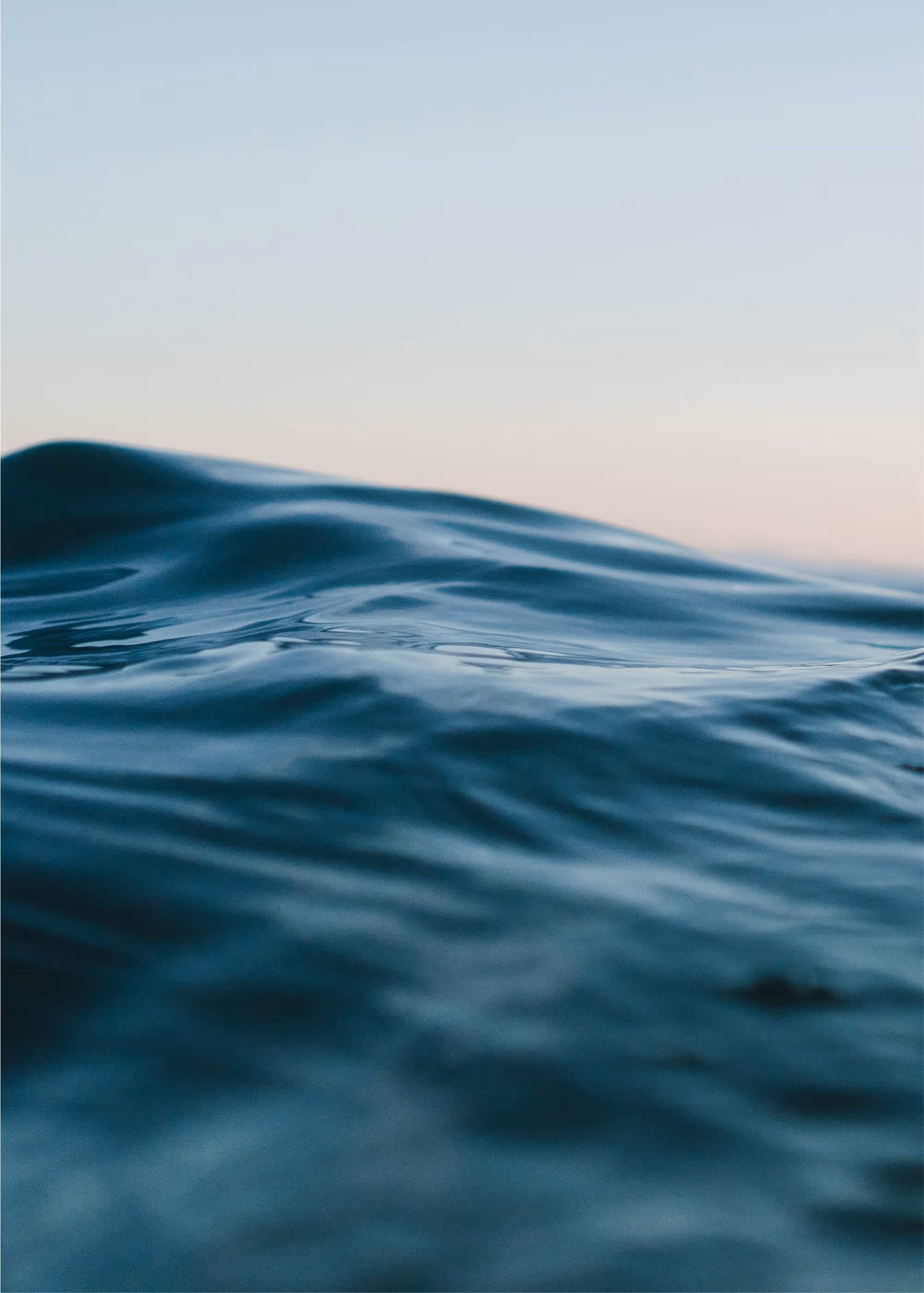 Calm water surface, reflecting the clarity and focus achieved when you change the game at work.