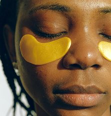A woman with eye patches on