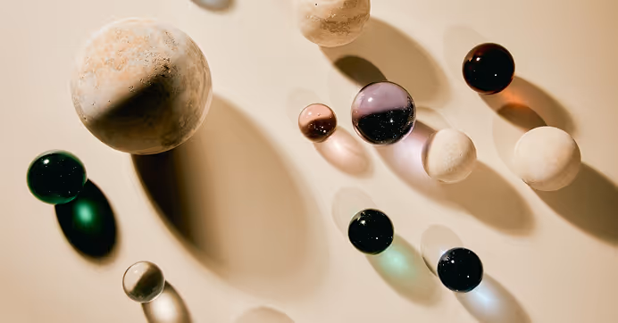 Miscellaneous minerals placed on a flat background with dramatic shadows