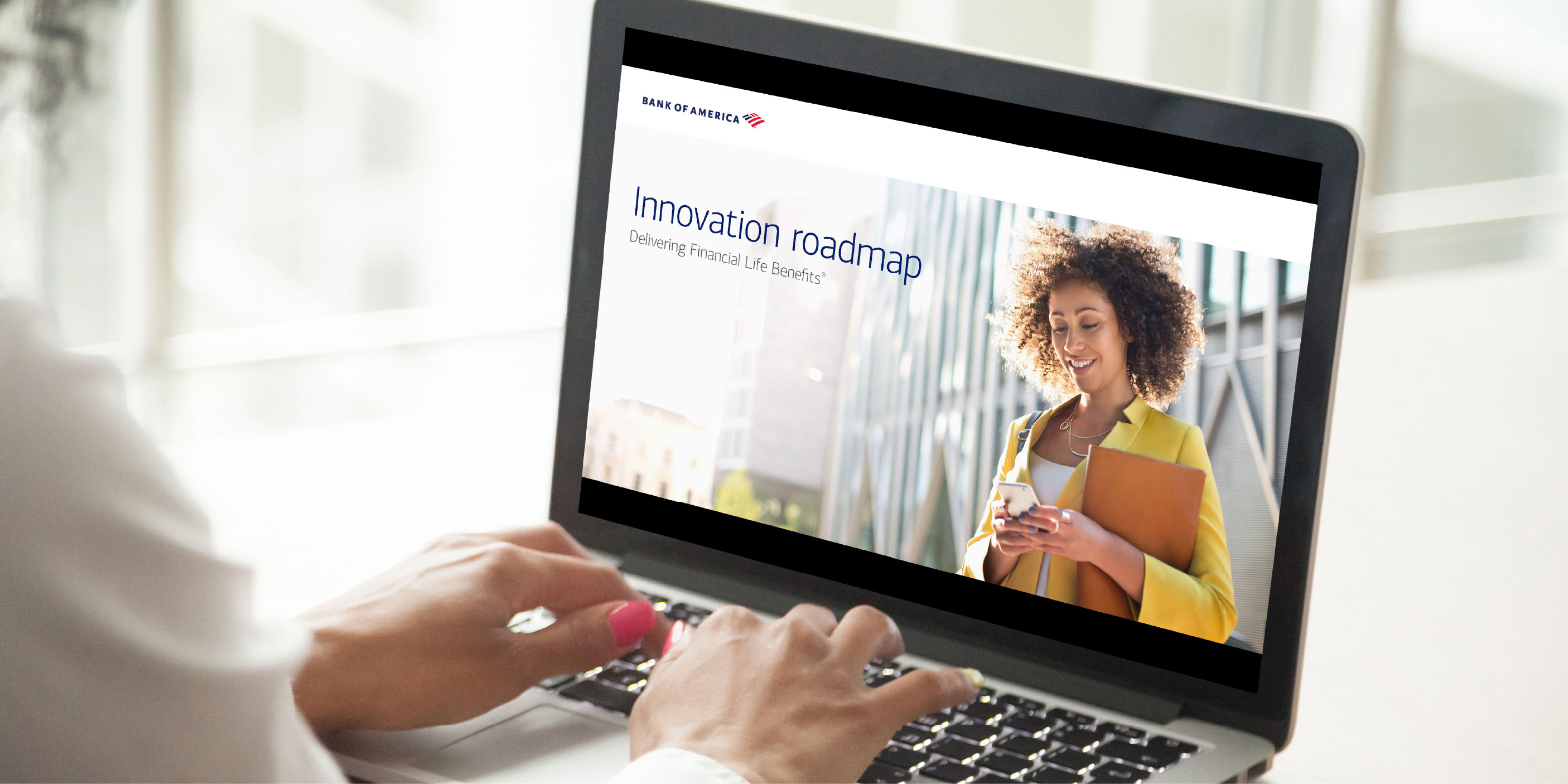Image of a woman using a laptop with Bank of America Innovation Roadmap on the screen