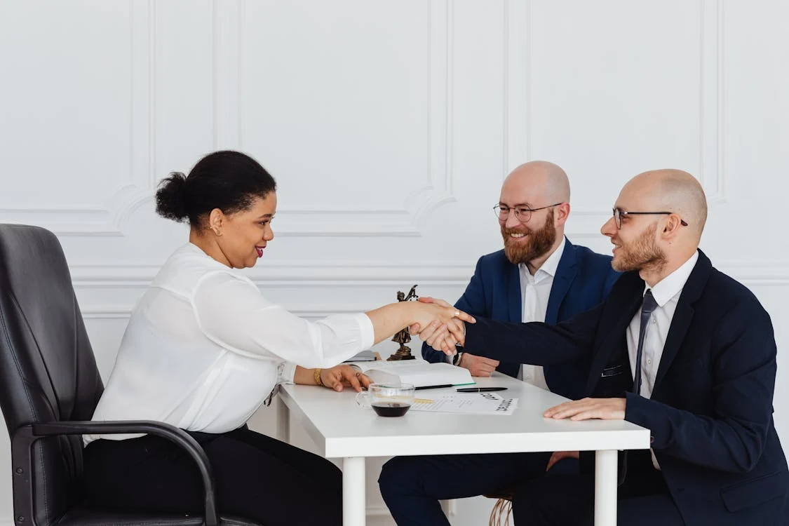 Businessmen in a Meeting with a Businesswoman