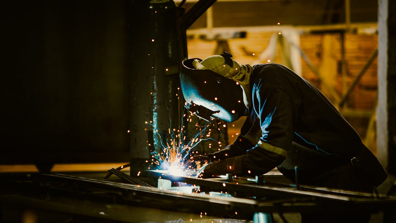 Person Wearing Protective Clothing Welding