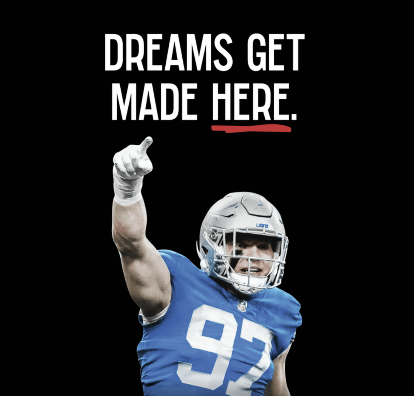 A football player in a blue jersey (#92) points upward, overlaid with the slogan “Dreams Get Made Here.”
