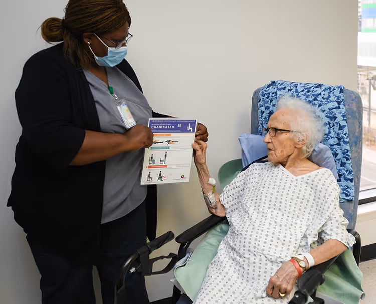 Patient doing BE-FIT exercises in hospital.