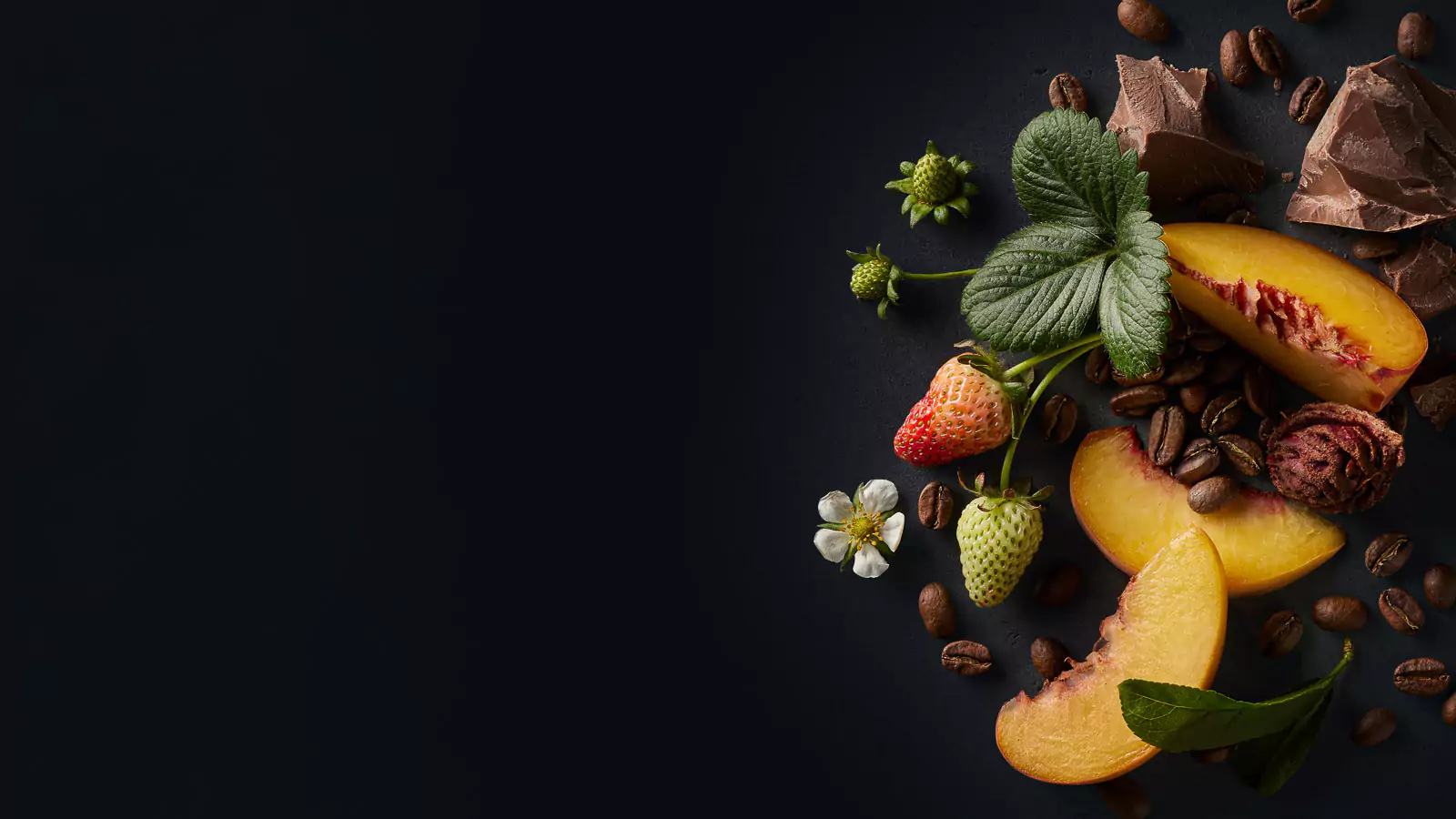 Coffee bean flavor profile featuring sliced peach, unripe strawberries, chocolate chunks, and coffee beans on a dark background.
