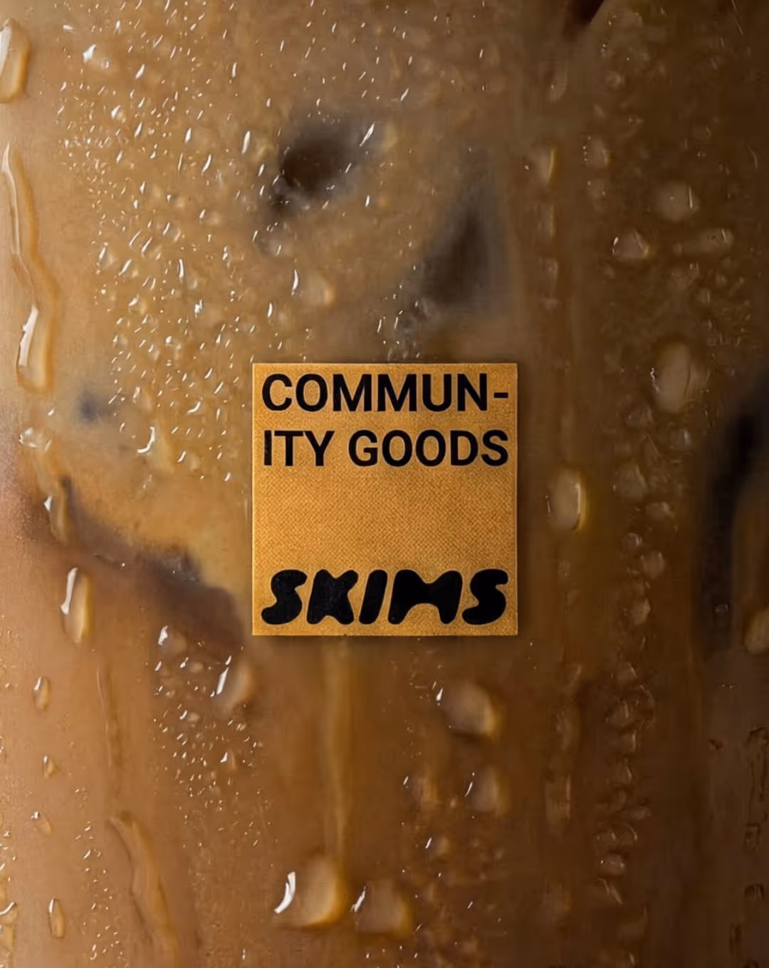 Skims community goods collab cup label close up