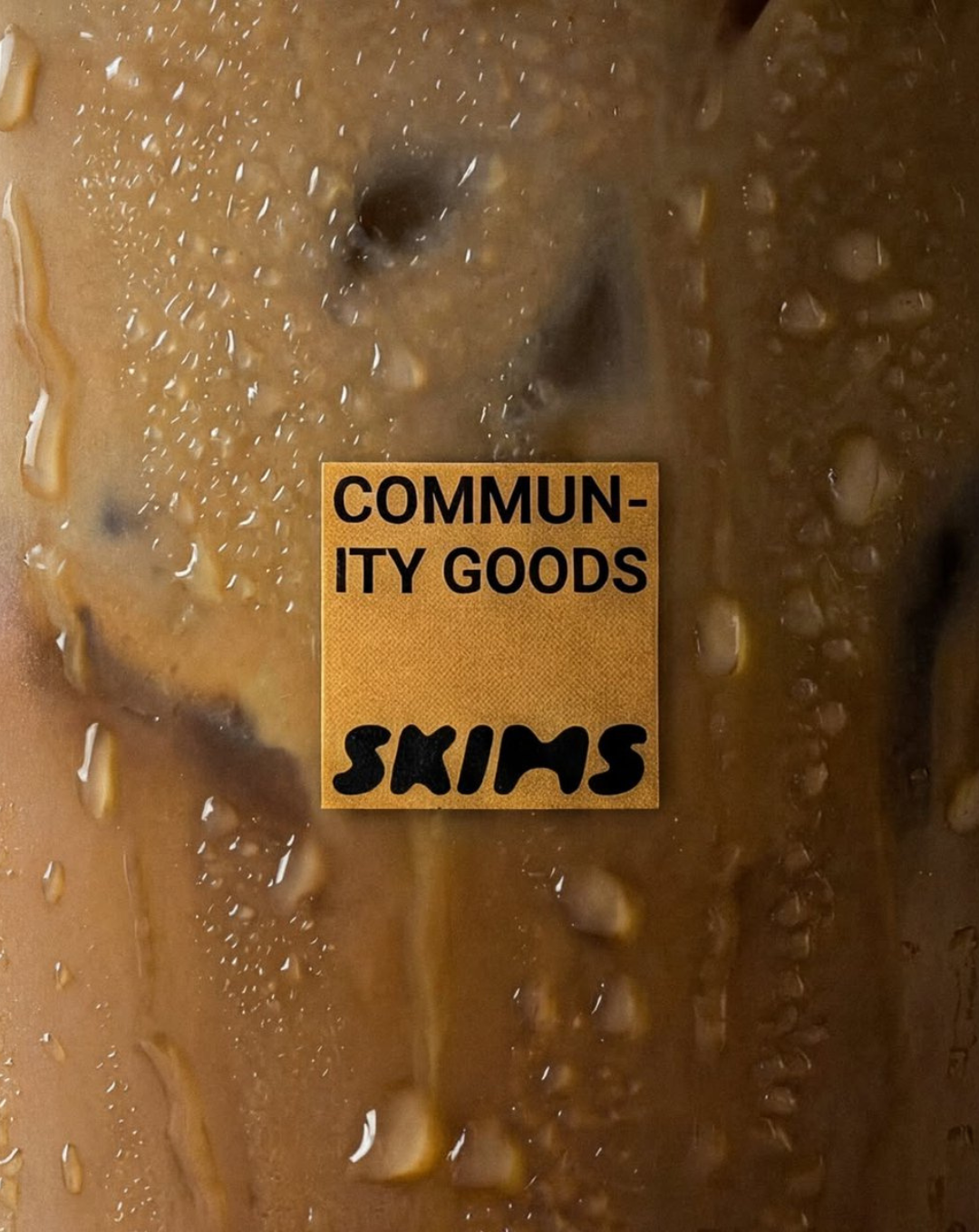 Skims community goods collab cup label close up 