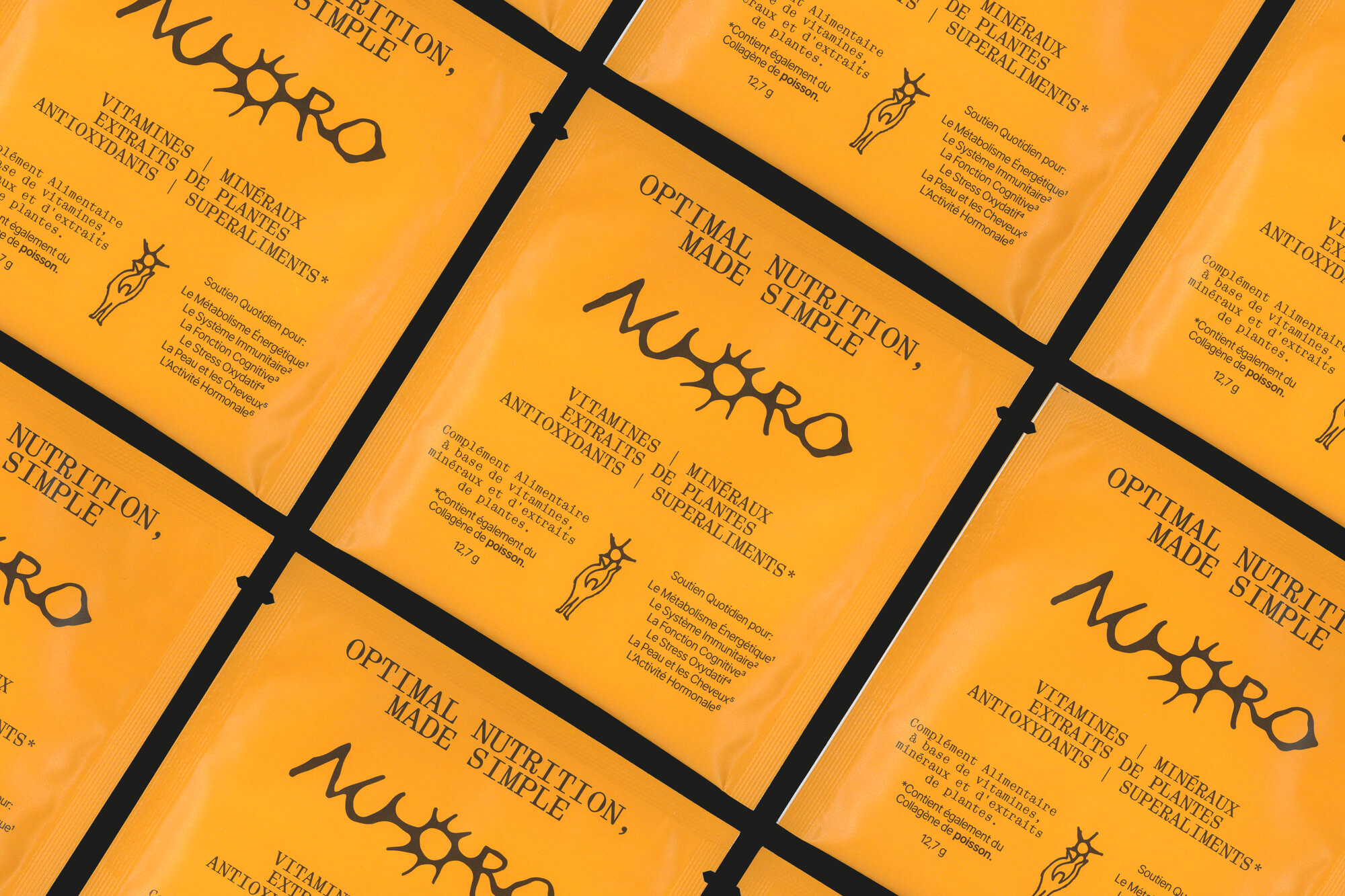 Flat lay of multiple Nuoro supplement sachets arranged in a grid pattern, showing the full packaging typography and illustrated brand system
