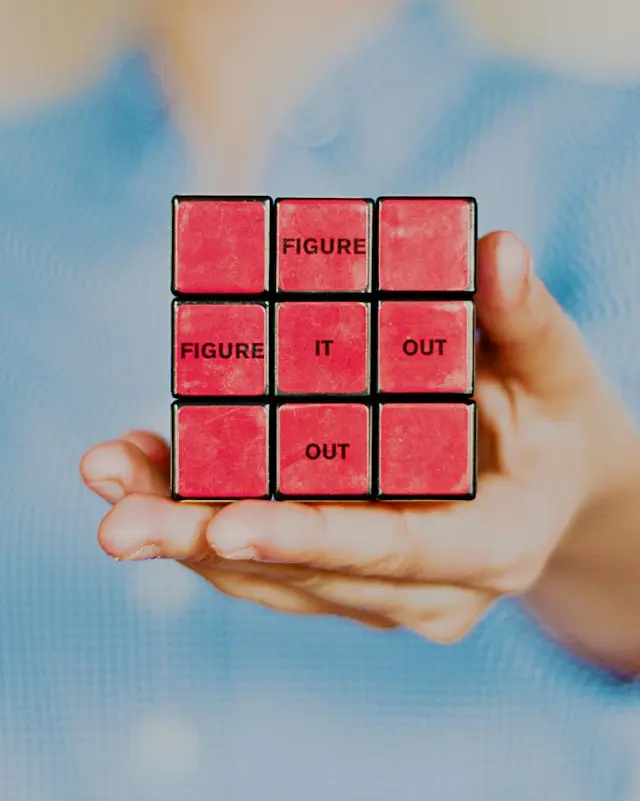 A photo of Rubik's Cube with the text "Figure it out" in Services Section