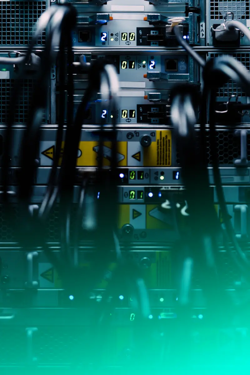Image of a server cable set up with plugs going into the back of the server.