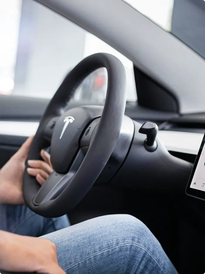 Driver's view of a connected car's dashboard screen with integrated applications.