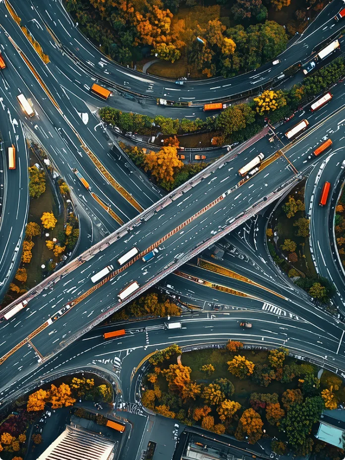 Aerial view of a busy city street grid and buildings representing urban interconnectivity.