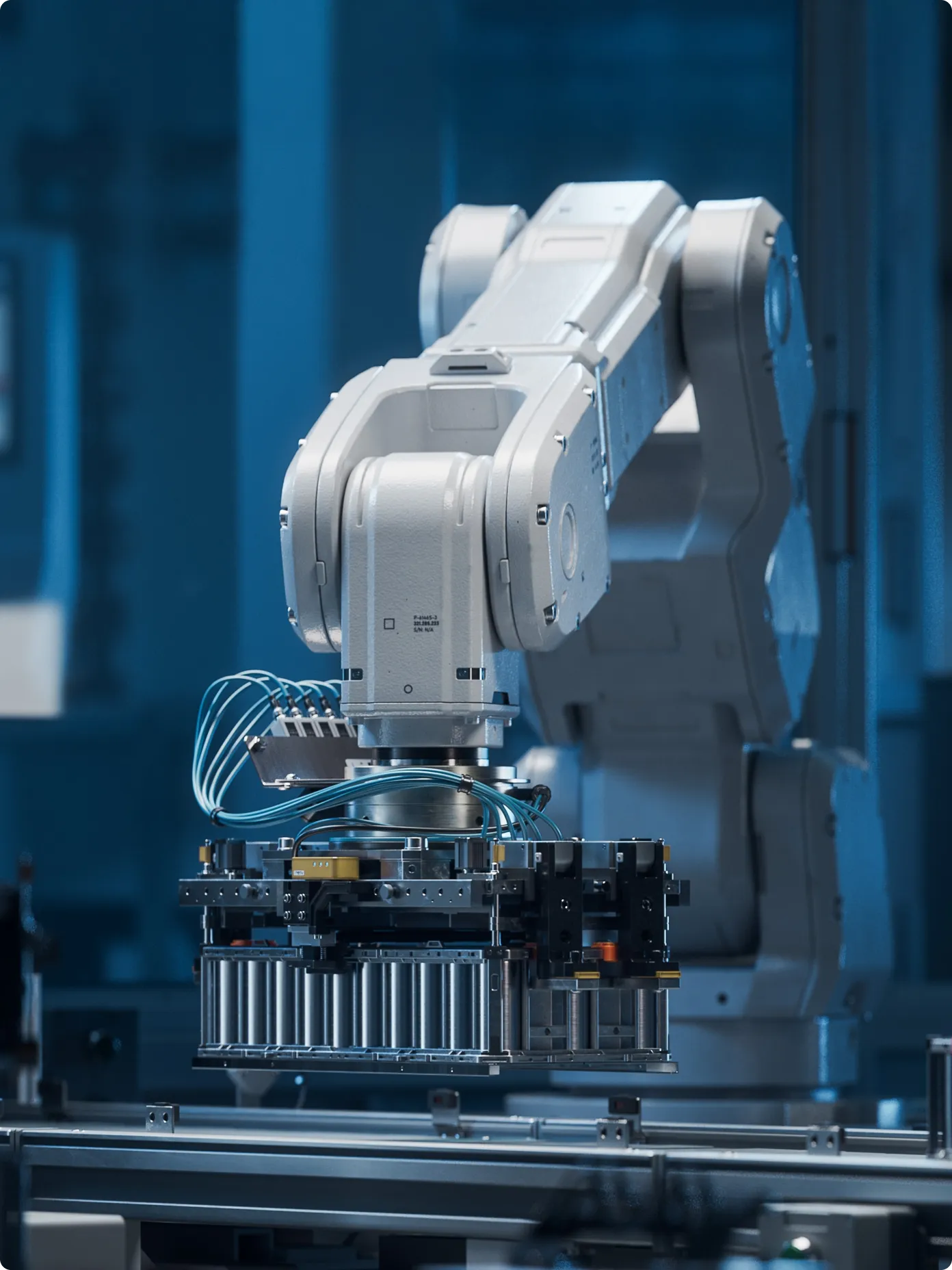 A robot operates a machine in a factory setting, showcasing automation in industrial work.